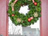 fir wreath with ornaments and ribbon