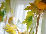 a natural fall garland of fall leaves and mini pumpkins is a cool decoration that you can easily make yourself
