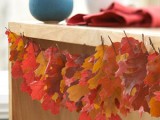 a garland of colorful dried fall leaves is a nice and bright decoration you can easily make