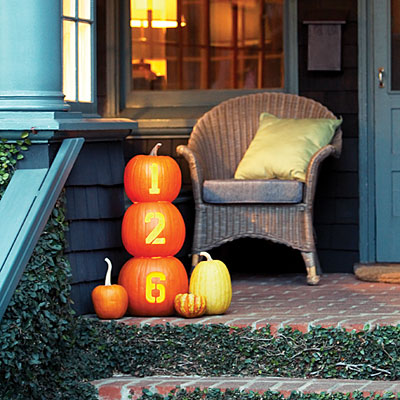 Making a glowing house number of pumpkins is one of those ideas that could be used for halloween decor too.