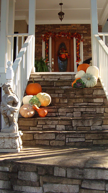 Placing pumpkins on your front steps is a great way to create the mood right away.