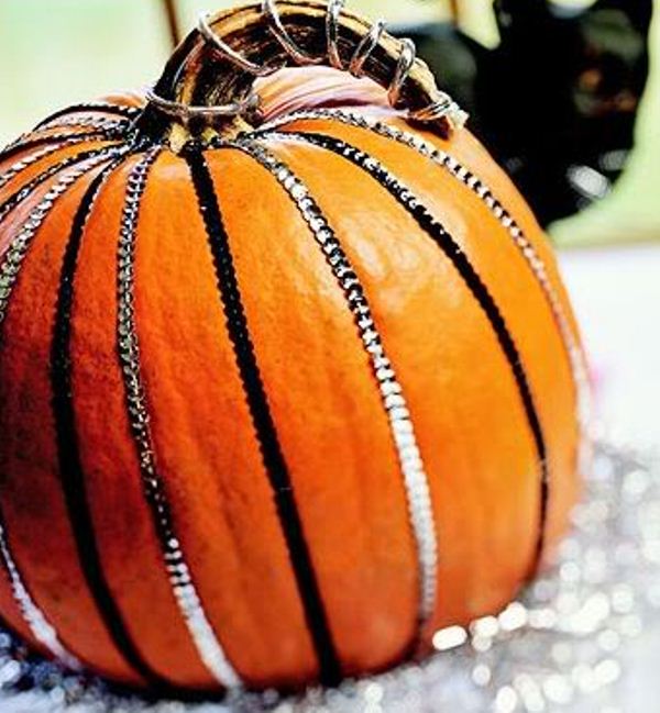 A glam pumpkin with sequin ribbons is a lovely decoration for the fall and it looks bright and fun