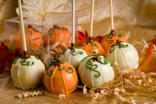 white and orange cake pops are perfect for a fall wedding dessert table, they bring the spirit