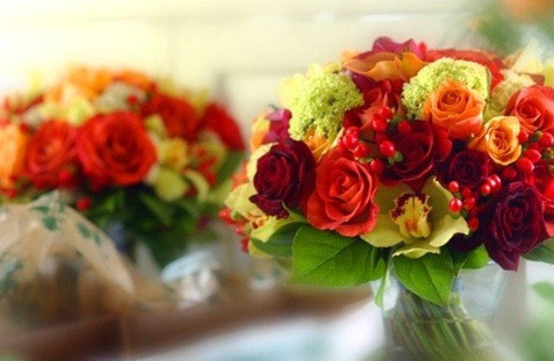 Bright fall floral arrangements with berries are lovely bouquets or centerpieces with plenty of color
