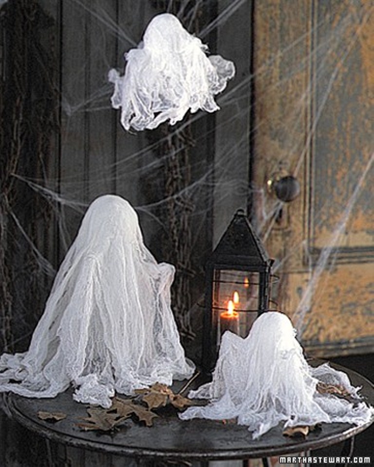 ghosts made of cheesecloth are amazing to decorate the space for Halloween and they are very easy to DIY anytime