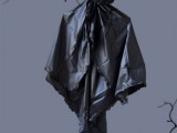 a black ghost of fabric is a simple and stylish decoration to go for and it can be DIYed easily