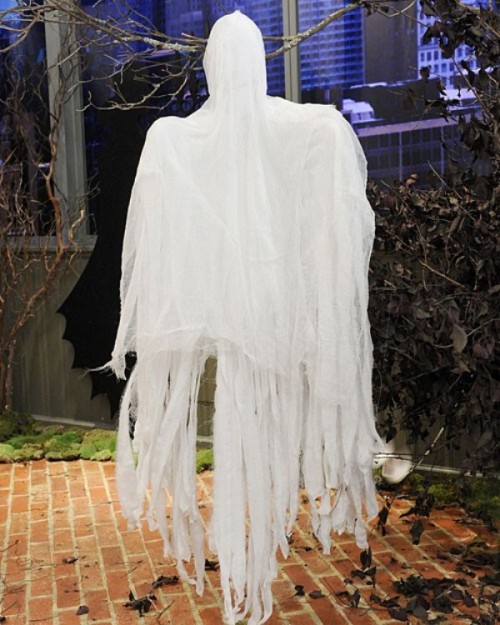 a cheesecloth ghost can be hung outdoors or indoors and it's very easy to craft anytime