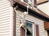 skeletons climbing up the wall can be a nice outdoor or indoor decoration that is very easy to install