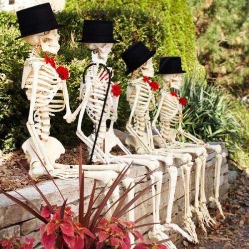 skeletons in top hats are an elegant decoration for outdoors or indoors, and they are easy to make