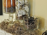 glasses with hay, skeletons and snakes for decorating a mantel for Halloween – arrange them as you want
