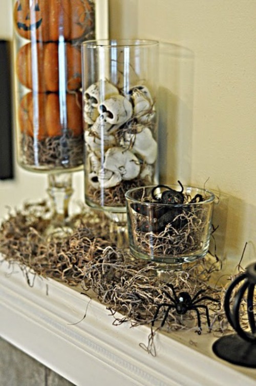 glasses with hay, skeletons and snakes for decorating a mantel for Halloween - arrange them as you want