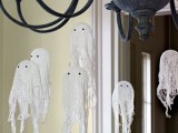 hang some cheesecloth ghosts on a chandelier to make the space look spooky enough but not too much