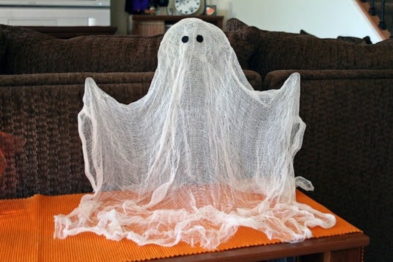 a cheesecloth ghost like this one is a nice and easy to make decoration for an adult or kid Halloween party