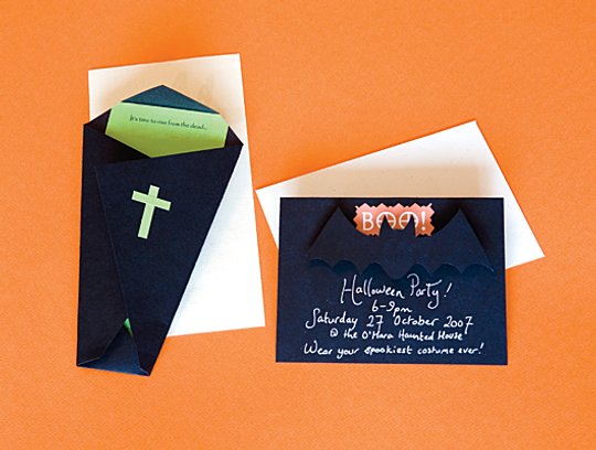 a black party invitation with a bat, a black coffin shaped invite with green and orange touches