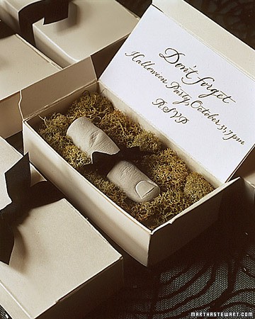 a box with moss and a cookie styled as a finger is a scary and yummy Halloween party invitation