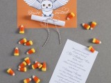 Hogwarts-styled Halloween party invitation with an orange owl envelope and candy corns