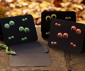 black invites with colorful googly eyes are bold, fun and easy to DIY, you can make as many as you want