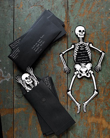 black and white skeletons in black envelopes are creative and cool party invitations that look super bold