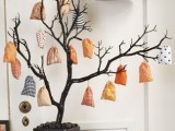 a black tree in a black urn, with colorful fabric sacks with mini favors is a fun idea for Halloween