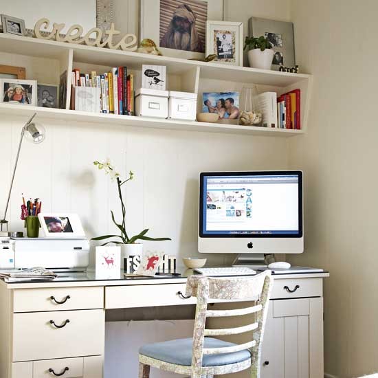 A cozy corner with a hanging shelving unit and a desk with a bunch of drawers usually are more than enough for a fully functional home office.