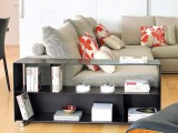 a dark metal bookcase can be placed next to the sofa to create a reading nook and to separate the sitting zone from the rest of the space