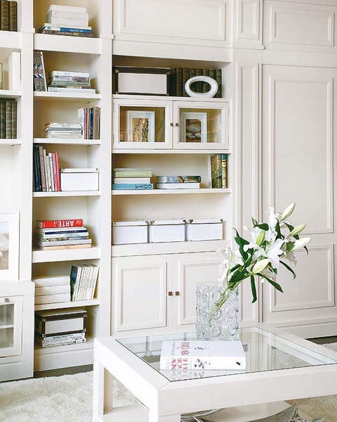 elegant white storage units with built-in bookshelves are a nice idea to go for, they will store a lot of things