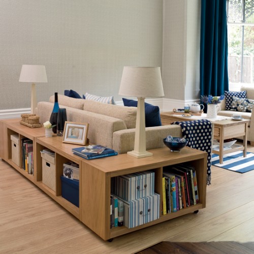 a comfortable modern storage unit for books and other stuff can be placed behind your sofa in the living room to save some space
