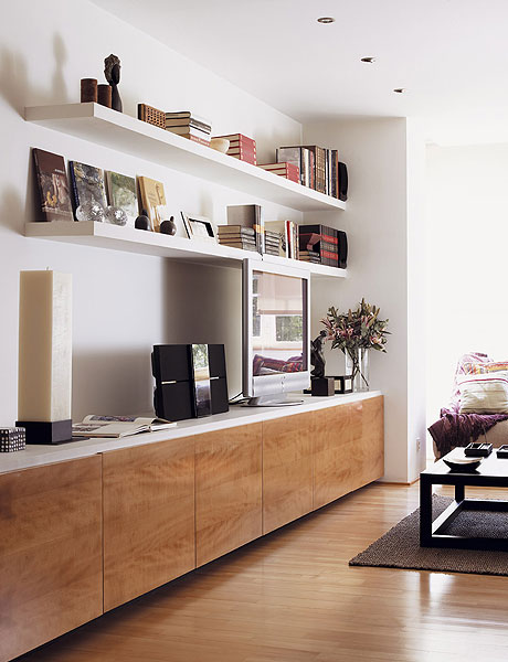 open bookshelves over the TV unit don't look bulky and are comfortable for storage, plus open shelves are very trendy now