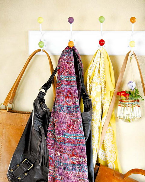 hooks is the most traditional way to store several scarves in a hallway