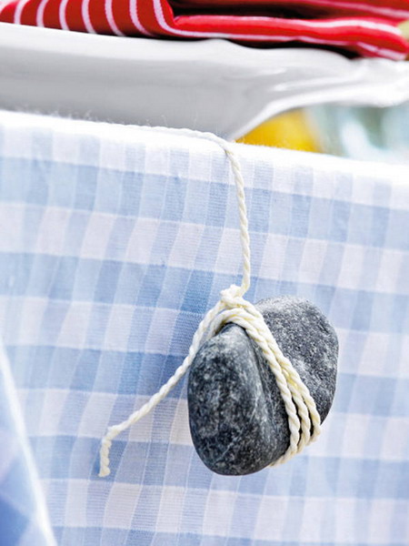 a large pebble on yarn is a cool idea to hold the tablecloth in place outdoors