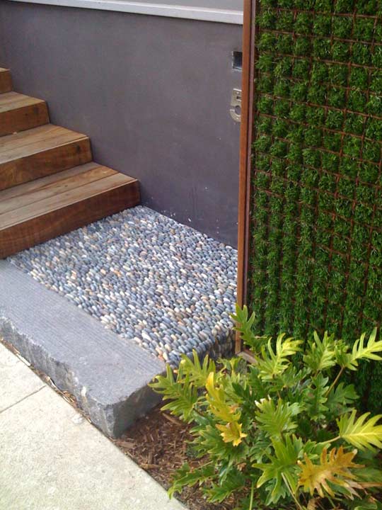 pebbles may be incorporated into garden paths to add a natural feel and make them more durable