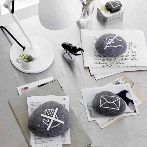 stylish paperweights of pebbles with modern images are a fun idea for your work desk