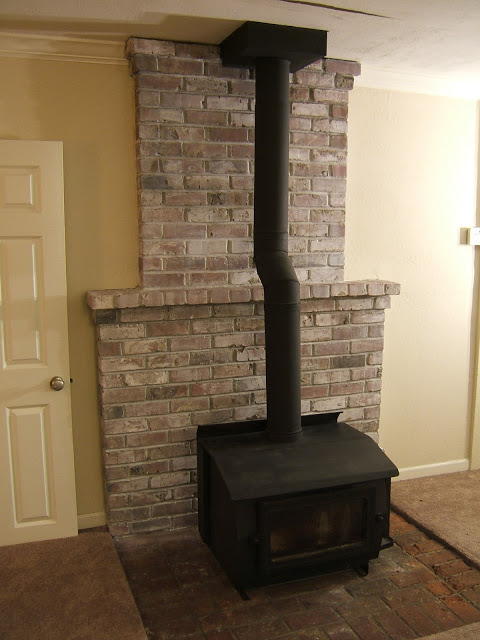 how to slightly whitewash a fireplace wall (via ninered)