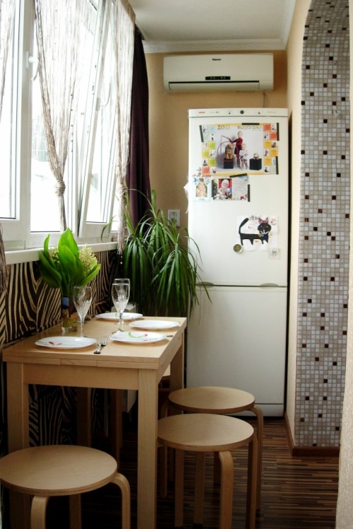 Combine your balcony with a kitchen and you have an additional space to hide a fridge in a plain sight.