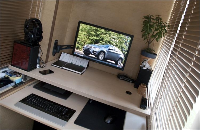 In small apartments it's a pretty common idea to use a balcony not only for storage but also as a home office.