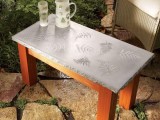 concrete table with a leaf pattern