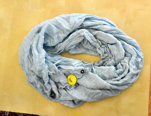button scarf (via sheknows)