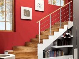a staircase with bookshelves under it and a floor lamp is a stylish idea for any space and can be DIYed