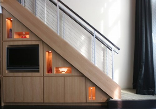 built-in niches, drawers and a TV right in the staircase will save you a lot of space and will look very neat and chic