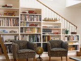 a staircase with whole bookcases under it – place a couple of chairs and you’ll get a ready reading space