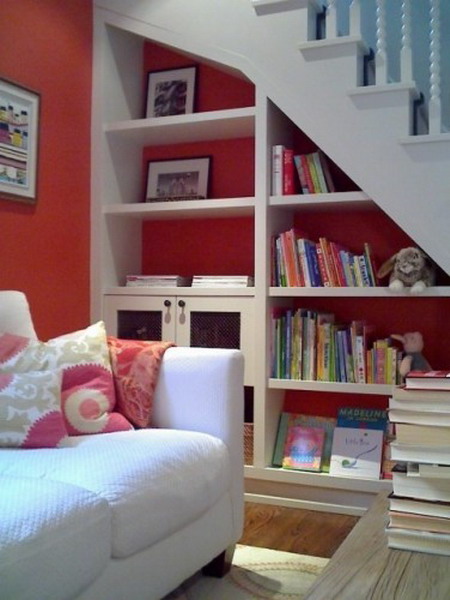 a staircase with built-in bookshelves is a stylish and cool idea for any living room