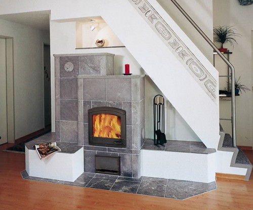 place a fireplace or a hearth under the staircase saving much space and getting a very cozy feature for the space