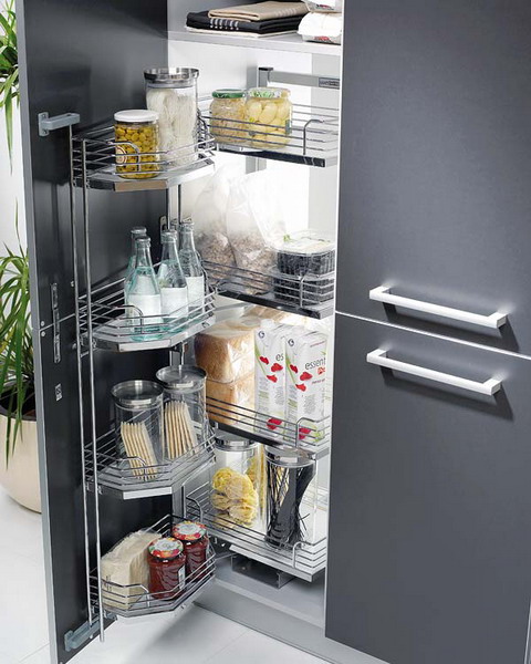 A small kitchen pantry with smart door storage and pull out shelves.