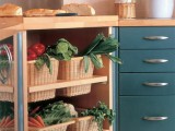 an open kitchen island with wicker cubbies and wicker drawers inside the island that offer storage space for vegetables and fruits