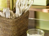 a rattan cubby as a cutlery holder is a cool rustic touch to any kitchen or dining space