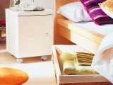if you have a tall bed, you can insert a wicker tray on wheels under it to add some storage and keep it hidden at the same time