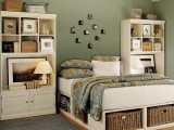 a bed with storage units – open ones for books and wicker cubbies for various stuff here and there