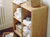 a storage unit on casters with open storage compartments – just insert some wicker cubbies for storing some small stuff