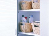 a pantry with round baskets that hold all the necessary stuff for cleaning and give a slight rustic feel to the space