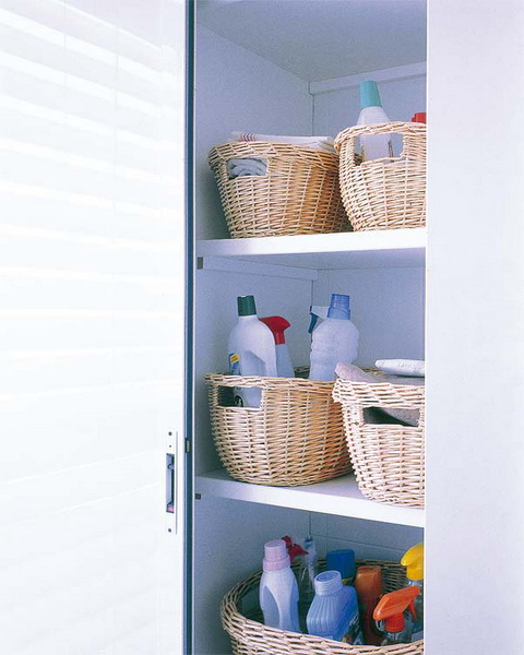 a pantry with round baskets that hold all the necessary stuff for cleaning and give a slight rustic feel to the space